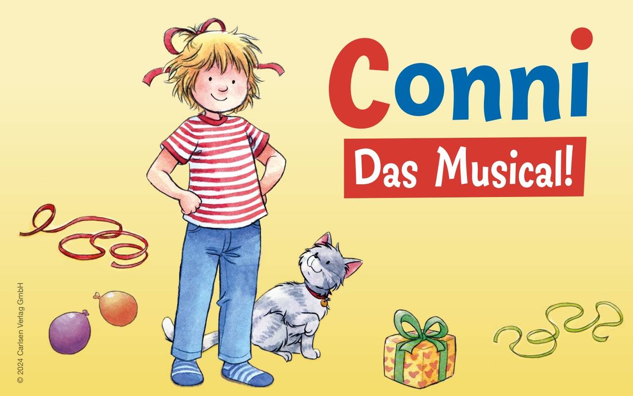 Das Foto zeigt Conni, eine Katze, Luftballons und ein Geschenk.